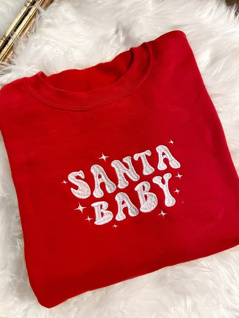 Get festive with our Santa Baby Crewneck Sweatshirt! The Unisex Sizing makes the sweatshirt run slightly larger than your average sweatshirt for women. Most men find their normal size to be more snug. If you want a slightly looser fit, size up one size. Please check out our size chart for measurements to ensure an accurate fit. PLEASE BE SURE TO INPUT YOUR CORRECT SIZE/COLOR + SHIPPING ADDRESS. We will not be responsible if it is incorrect! Refunds/Exchanges accepted, please read our Refund Poli Retro Christmas Sweatshirt, Christmas Crewneck Sweatshirt Cricut, Winter Sweatshirt Ideas, Cute Christmas Sweatshirts, Christmas Embroidery Sweatshirts, Embroidered Clothes Ideas, Christmas Sweaters Aesthetic, Vinyl Sweatshirt Ideas, Sweatshirt And Shirt Outfit