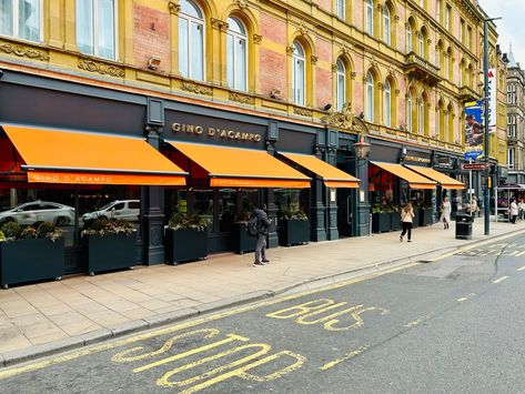 Italian Awning, Orange Awnings, Restaurant Awning Design, Awning Restaurant, Restaurant Awning, Commercial Awning, Fabric Awnings With Gold Logo, Striped Awning Store Fronts, Commercial Canopy