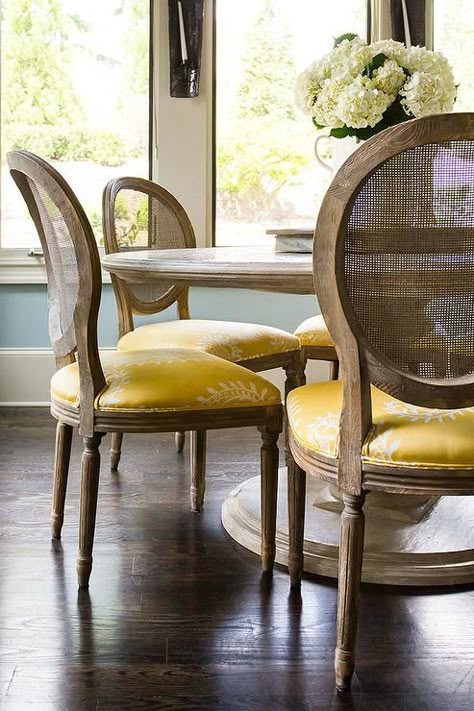 Round Marble Top Dining Table with Round Cane Back Chairs and Yellow Seat Cushions, Transitional, Dining Room Round Marble Top Dining Table, Round Back Dining Chairs, Cane Back Chairs, Chic Dining Room, Transitional Dining Room, Marble Top Dining Table, Dining Room Seating, Dining Room Inspiration, Dining Room Design