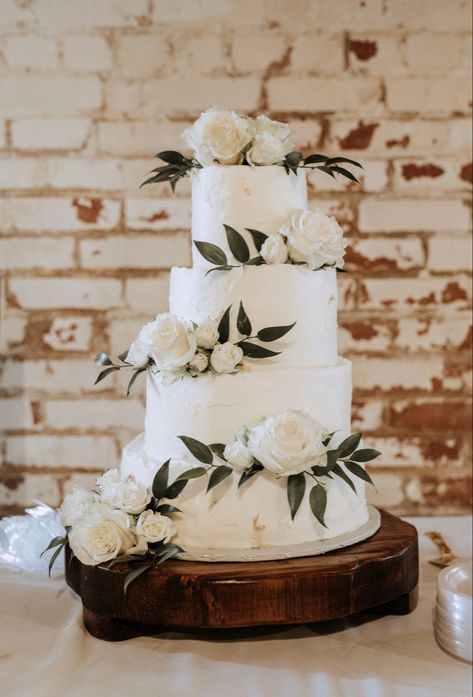 Here is my take on a Rustic with a modern twist! Golden flakes & white roses P.s. this is my wedding cake, and i did bake it myself😊 Wedding Cake White And Green Flowers, Wedding Cake Ideas Elegant Sage Green, Wedding Cake Designs Eucalyptus, Minimal Floral Wedding Cake, Wedding Cakes Green And White, Plain White Wedding Cake With Flowers, All White Floral Wedding Cake, White Flowers On Wedding Cake, Wedding Cakes Greenery