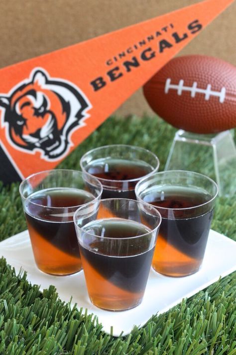 Cincinnati Bengals Jell-O Shots (3 oz. orange Jell-O 2 envelopes plain gelatin 2 cup vodka  3 1/2 Tbs grape Jell-O powder 3 1/2 Tbs lime Jell-O powder Black food coloring) Jell O Shots Recipe, Super Bowl Drinks, Jell O Shots, Jelly Shots, Football Snacks, Bengals Football, Themed Drinks, Superbowl Snacks, Superbowl Party Food