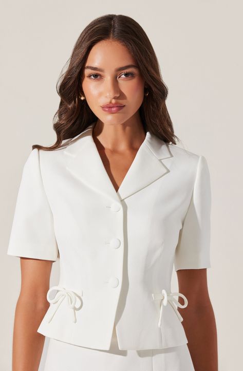 Bow embellished short sleeve blazer Notched lapel collar, shoulder padding Decorative bow detail, faux front pockets Fully lined, exclusive of collar and button placket Button front closure Dry clean only Self: 96% Polyester, 4% Elastane / Lining: 100% Polyester Style #ACT18714 Embellished Blazer, Embellished Shorts, Decorative Bows, Astr The Label, White Blazer, Black Blazers, Bow Detail, Lapel Collar, Button Placket