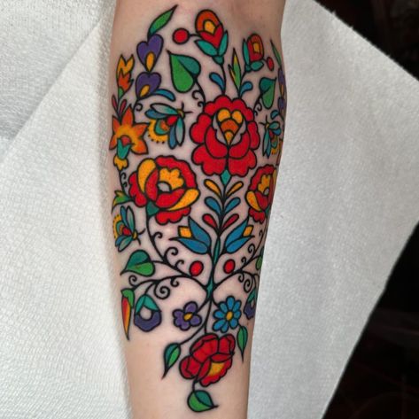 Had so much fun tying this into a previous Hungarian folk piece that was made over 10 years ago! Casey’s grandmother was from Hungary and… | Instagram Polish Art Tattoo, Swedish Folk Art Tattoo, Hungarian Embroidery Tattoo, Folk Style Tattoo, Folk Flower Tattoo, Hungarian Tattoo Ideas, Western Traditional Tattoo, Grandmother Tattoo, Hungarian Tattoo