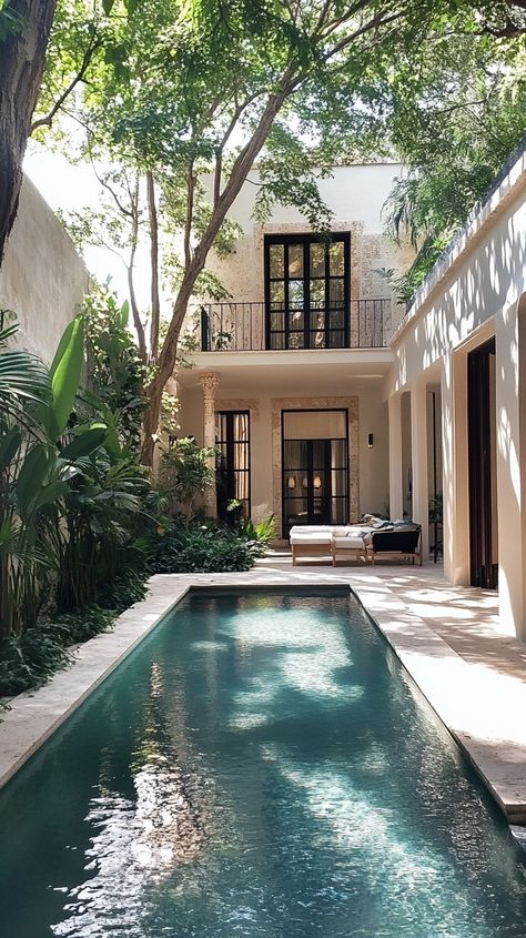 Luxury villa in Merida, Mexico, surrounded by colonial architecture and lush courtyards, offering soft natural light and serene ambiance. Tulum Airbnb, Tulum Villa, Places To Rent, Historic Architecture, Colonial Architecture, Luxury Rentals, Global Travel, Luxury Villas, Private Villas