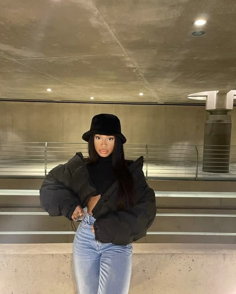 Bucket hat, black puffer jacket, makeup, baddie, gorgeous gal, denim Baddie Outfits With Puffer Jackets, Beanie And Puffer Jacket Outfits, Puffy Hat Outfit, Crop Black Puffer Jacket Outfit, Short Black Puffer Jacket Outfit, Styling Black Puffer Jacket, Black Bucket Hat Outfit Winter, Jacket Around Waist Outfits, Denim Puffer Jacket Outfit