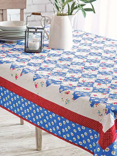 Bring that down-home feeling back to your table with a farm-style table quilt. It's the perfect finishing touch. Size: 56" x 811/2". Previously published in Annie's Quick & Easy Quilts Spring 2019. Skill Level: Confident Beginner Quilt Tablecloth Patterns, Quilted Table Cloth, Quilted Tablecloth, Easy Quilting Techniques, Farm Style Table, Table Quilt, Binding Tutorial, Table Quilts, Quilts Decor