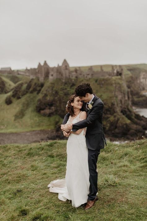 This micro wedding takes place in Ireland overlooking the Atlantic Ocean. Photo by Paula McManus Photography Elopement With Family, Castle Elopement, Ireland Elopement, Dunluce Castle, Best Destination Wedding Locations, Dark Hedges, Elopement Planning, Destination Wedding Locations, Small Intimate Wedding