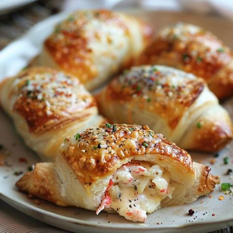 Crab & Cheese Filled Crescent Rolls are delightfully flaky pastries filled with a savory mixture of crab and creamy cheese. They’re not heavy or overly rich either. I think they’re a perfect appetizer or snack for any gathering, and if you’re not a fan of crab, feel free to substitute it with another seafood or even chicken. They will still be undeniably delicious! If you’re looking for a light and savory treat that’s not overly complicated to make, you’ve come to the right place. When you ... Crab And Cream Cheese Crescent Rolls, Crab And Cheese Filled Crescent Rolls, Strange Recipes, Cressant Rolls, Cheese Filled Crescent Rolls, Filled Crescent Rolls, Crescent Roll Appetizers, Cream Cheese Crescent Rolls, Cheese Crescent Rolls