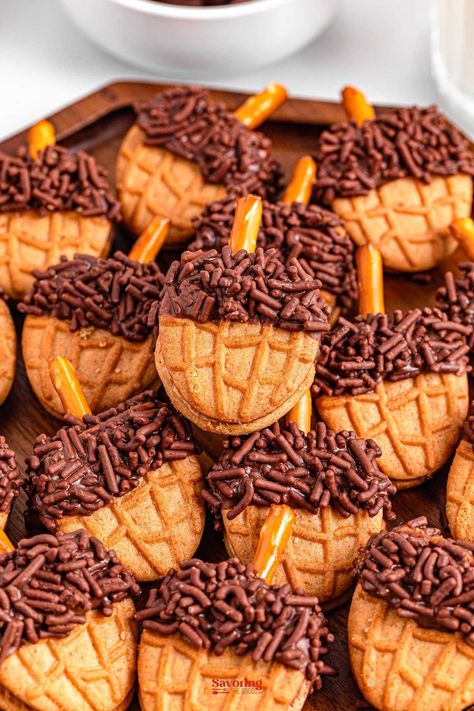 These acorn cookies are the creative no-bake recipe that transforms Nutter Butter cookies into cute acorn-shaped treats using chocolate, a pretzel piece, and sprinkles. https://www.savoringthegood.com/acorn-cookies-recipe/ Nutter Butter Acorns, Acorn Recipe, Acorn Cookies, Fig Jam Recipe, Chocolate Covered Nuts, Peanut Butter Sandwich Cookies, Pumpkin Whoopie Pies, Chocolate Melting Wafers, Peanut Butter Oreo