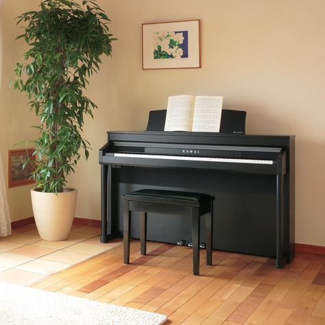 If you haven't tried Kawai digital pianos lately, you'll be astonished by their exquisite sound and feel. A Kawai digital piano is the perfect cultural and educational addition to your home. #kawaipiano #digitalpiano #music #piano #pianogram #musiceducation Piano Corner, Neutral Apartment Decor, Modern Industrial Apartment, Piano Room Decor, Piano Living Rooms, Piano Table, Piano Stand, Home Office Layouts, Piano Decor