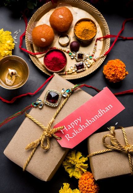 Premium Photo | Raksha bandhan / rakshabandhan rakhi with haldi kumkum rice, sweet mithai, gift box, selective focus Rakshabandhan Hampers, Rakhi Shoot, Sweet Mithai, Haldi Kumkum, Spiritual Logo, Rakhi Festival, Raksha Bandhan Gifts, Happy Rakhi, Rakhi Gift