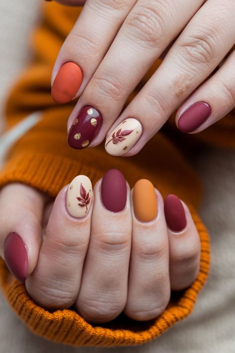 Dive into the season with these stunning round fall nail ideas that perfectly blend style and comfort. Featuring a rich berry base topped with golden leaf accents, this design captures the essence of autumn. The round shape adds a soft elegance, making your nails look effortlessly chic. Perfect for cozy gatherings or a casual day out, these fall nail ideas will leave everyone admiring your seasonal flair! Fall Round Nails, Acorn Nails, Franche Nails, Autumn Leaf Nails, Nails Fall Autumn, Berry Nails, Warm Color Palette, Fall Nail Ideas, Nail Business