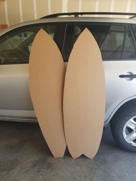 Diy Surf Party Decorations, Cardboard Surfboard Decoration, Summer Beach Theme Party Decorations, How To Make A Surfboard Out Of Cardboard, Diy Surf Board Prop, Beach Party Diy Decorations, Tropical Party Ideas For Adults, How To Make A Surfboard, Surfing Centerpieces