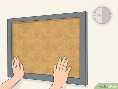 3 Easy Ways to Hang Cork Board - wikiHow Up Bulletin Board, Cubicle Wall, Diy Cork Board, Cork Boards, Cork Tiles, Framed Cork Board, Cement Wall, How To Hang, Picture Hangers