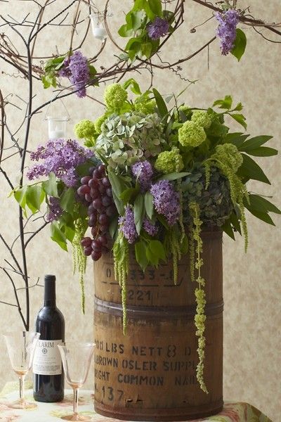 The colours, plus blue.  Lilacs are pretty but WAY too expensive.  Def the green hanging amaranthus.  Like the viburnum. No grapes. Tuscany Wedding Theme, Bouquet Champetre, Wine Tasting Events, Flowers And Greenery, Gorgeous Centerpieces, Wine Tasting Party, A Bottle Of Wine, Tasting Party, Bottle Of Wine