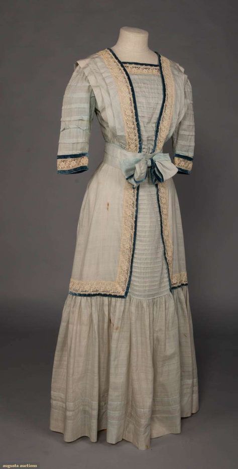 Edwardian day dress, 1908-1909 | pale blue silk day dress trimmed w/ white lace & blue velvet, square neck, pleated bodice & sleeves, self sash belt, CF oversized bow, 3 velvet bows to CB, c. 1908, B 35", W 25", L 54", (staining throughout, especially in torso). 1900 Aesthetic, Edwardian Day Dress, 1909 Fashion, Edwardian Gowns, Outdoors Quotes, Education Art, Velvet Bows, 1900s Fashion, 1910s Fashion