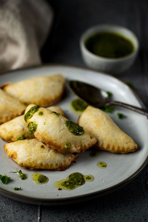 These Vegetarian Empanadas are made with smoky poblano peppers, paprika, creamy cheese, a little onion & fresh cilantro in a buttery, flaky pie crust. Served with a fresh chimichurri sauce for dipping, these bean empanadas are the perfect party or game day appetizer! These homemade empanadas are so easy to make and so incredibly delicious - they will please everyone!! #wenthere8this #vegetarianempanadas #homemadeempanadas #empanadas Bean Empanadas, Empanadas Recipes, Homemade Empanadas, Vegetarian Empanadas, Empanada Recipes, Buttery Flaky Pie Crust, Desert Theme, Poblano Peppers, Chimichurri Sauce