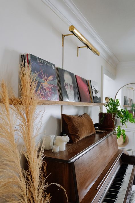 Becky's 70s Mid Century Modern Inspired Home Tour — The Sorry Girls Piano Record Player Vinyl Display Piano With Shelves Above, Mid Century Modern Piano Room, Mid Century Piano Room, Piano House Decor, Piano Mid Century Modern, Mid Century Piano, Jazz Revival Aesthetic Home, Mid Century Man Cave, Piano Entryway Ideas