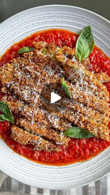 Zena Kamgaing on Instagram: "CRISPY AUBERGINE PARMIGIANA! @zenaskitchen  Crispy fried aubergine, served over a spicy tomato sauce and topped with lots and lots of @parmigianoreggianouk - a deconstructed aubergine parmigiana, if you will #ad  The full recipe is on my website zenaskitchen.com, which is also linked in my bio. I hope you’ll give it a go!  #parmigianoreggiano #parmigianoreggianouk #tasteofeurope #enjoyitsfromeurope #auberginerecipes #crispyaubergine" Eggplant Francaise, Fried Aubergine Recipe, Graffiti Eggplant Recipes, Crispy Aubergine, Fried Aubergine, Vegan Eggplant Parmigiana, Authentic Eggplant Parmigiana, Aubergine Recipe, Spicy Tomato Sauce