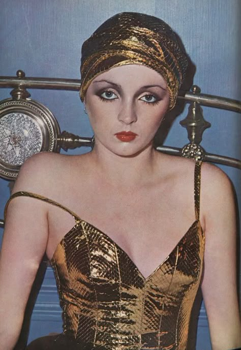 1973, Givenchy cobra turban and bra top - photographed by David Bailey for Vogue UK