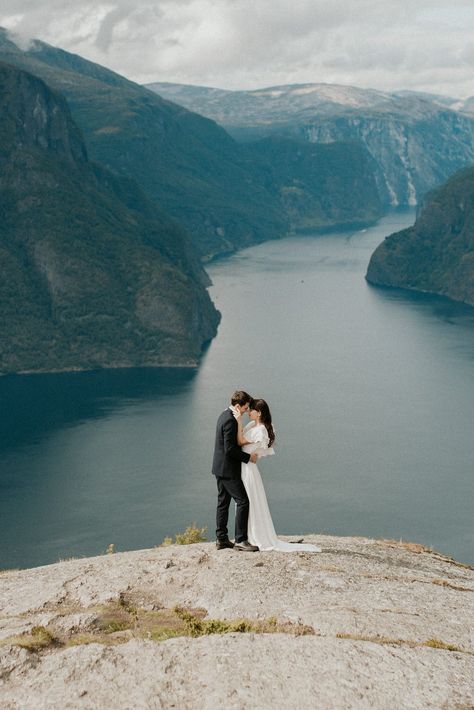 Adventurous Norway Elopement | Wedding Photographer - Emily Kidd Photo. A bride and groom hiking to their wedding ceremony in the Fjords of Norway. Their outdoor wedding ceremony had incredible views! See the views at https://emilykiddphoto.com/adventurous-norway-elopement-wedding-photographer/ #norway #aurland #fjord #wedding #elopement #elope #norwaywedding #norwayweddingphotographer Norway Engagement Photos, Fjord Wedding, Norway September, Norway Elopement, Wedding Views, Norway Wedding, Elopement Destinations, Adventurous Wedding, Pagan Wedding