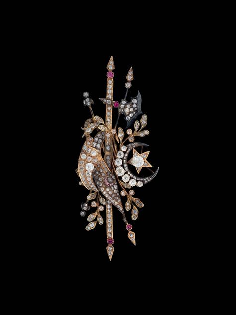 A DIAMOND INSET BROOCH, OTTOMAN TURKEY, 19TH CENTURY, Silver gilt settings with inset diamonds and rubies, formed as a stylised version of the Ottoman coat of arms consisting of the large crescent moon and star along with two flags, one with a pink crescent, representing the flags of the Ottoman dynasty and that of the Islamic Caliphate, set on a base of pointed weapons and scrolling vines, some small areas of rubbing to the gilt surface, with large pin on reverse, 3¾in. (9.7cm.) long Ottoman Jewelry, Gold Png, Crescent Moon And Star, Antique Ottoman, Antique Engagement Ring, 1928 Jewelry, Bracelets Design, Turkish Art, Jewellery Gold