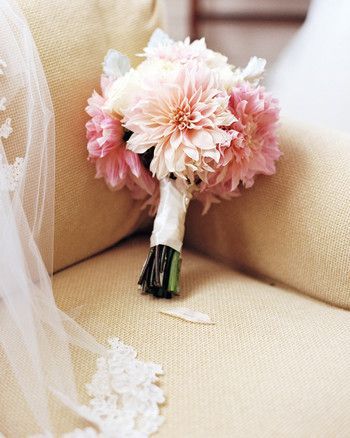 single flower wedding bouquet pink dahlias on tan couch Dahlia Wedding Bouquets, Tan Couch, Wedding Bouquet Pink, Dahlia Wedding, Small Bridal Bouquets, Pink Dahlias, Small Wedding Bouquets, Simple Wedding Bouquets, Dahlias Wedding