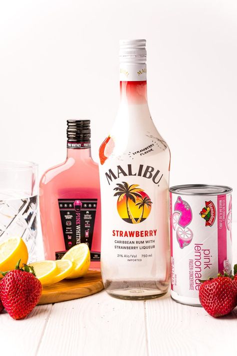 Strawberry Pink Lemonade Vodka Cocktail combines Pink Whitney Vodka, Strawberry Malibu Rum, and Pink Lemonade for the best refreshing drink! This large batch cocktail is ready in just 5 minutes! Pink Lemonade Martini, Pink Drinks Alcohol, Strawberry Rum Drinks, Strawberry Malibu, Strawberry Pink Lemonade, Pink Alcoholic Drinks, Cocktail Punch, Pink Lemonade Vodka, Malibu Rum Drinks