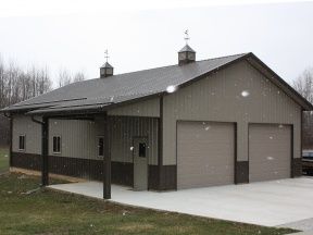 30x50 Shop Plans, Taupe Metal Building, Pole Shed Ideas, 40x40 Shop, Burnished Slate Metal Building, Gray Pole Barn With Black Doors, Barn Garage Plans, Pole Barn Shop, Pole Barn Garage Doors Long Panel