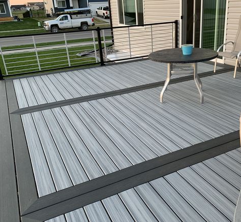 Picture frame Trex with RodRail signature railing Deck Picture Framing, Picture Frame Decking, Picture Frame Deck Design, Picture Frame Deck, Trex Pebble Grey Deck, Rocky Harbor Trex Decking Ideas, Trex Deck Ideas, Grey Trex Deck With Black Railing, Trex Patio