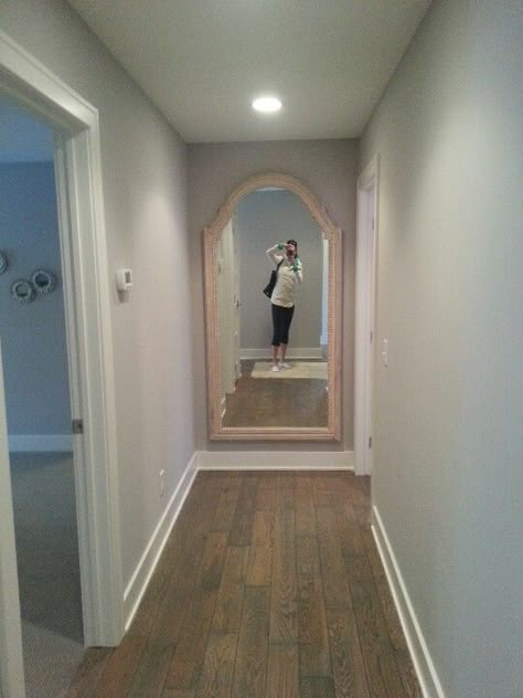 Love the big mirror at the end of the hallway--really extends the look of the hallway and brightens things up Mirror At End Of Hallway, End Of Hallway, Hallway Vintage, Hallway Ideas Diy, Hallway Design Ideas, Farmhouse Hallway, Wallpaper Hallway, Hall Mirror, Hall Mirrors