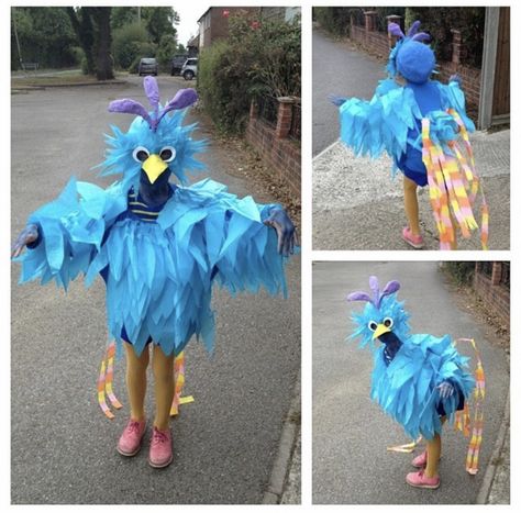 Made by Nicola and Tilly House out of tissue paper and a glue gun..the mask is made around an old pair of sunglasses with the lenses popped out. amazing what you can do.. not so good in the rain though!! Roly-poly bird for Roald Dahl day! World book day, school dressing up day, roly poly bird costume, roly-poly bird, Roald Dahl, roald Dahl book day, the enormous crocodile, the twits, tissue paper, glue gun, costume, blue bird, bird costume. Rio Birds Costume, Roly Poly Bird Costume, Rio Bird Costume Women, Rio Birds Halloween Costume, Rio Linda Bird Costume, Roald Dahl Dress Up, Roald Dahl Costumes, Big Bird Costume, Bird Costumes