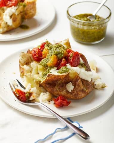 Summer Baked Potatoes with Ricotta, Blistered Tomatoes & Pesto | Kitchn Meat Free Dinners, August Recipes, Blistered Tomatoes, Creamy Mashed Cauliflower, New Vegetarian, Cooking Potatoes, Potatoes And Rice, Stuffed Baked Potatoes, Veggie Ideas