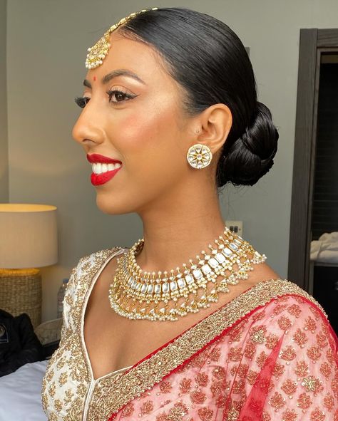 One of my favessss!! 🥨 Loved how elegant and sleek this was to go with the whole look for Shree’s wedding day Bridal makeup @_beautybyami Outfit @frontierraasuk Jewellery @thejewellerytrunk_ #weddinghair #wedding #bridalhair #bride #weddingdress #weddingmakeup #weddingphotography #weddingday #weddinginspiration #hair #bridalmakeup #updo #hairstylist #makeup #hairstyle #hairstyles #bridetobe #makeupartist #bridal #bridesmaids #weddings #love #weddinghairstyle #weddinghairstyles #weddingp... Hairstyles On White Lehenga, Day Bridal Makeup, White Lehenga, Indian Wedding Hairstyles, Bollywood Hairstyles, Makeup Hairstyle, Wedding Looks, Wedding Hair, Bridal Makeup