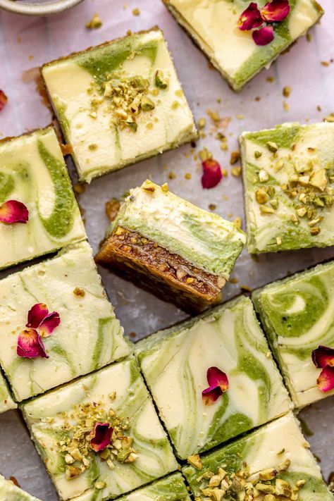 These creamy baklava cheesecake bars have a crunchy baklava crust made with walnuts, pistachios, and layers of phyllo pastry and get topped with swirls of vanilla and green pistachio cheesecake batter. Perfect for the holiday season, this dreamy cheesecake gets doused in honey syrup and is made in half the time of a traditional cheesecake! Pistachio Cheesecake Bars, Honey Pistachio Baklava Cheesecake, Banoffee Cheesecake, Quick Cheesecake, Traditional Cheesecake, Phyllo Pastry, Pistachio Cheesecake, Pistachio Dessert, Baklava Cheesecake