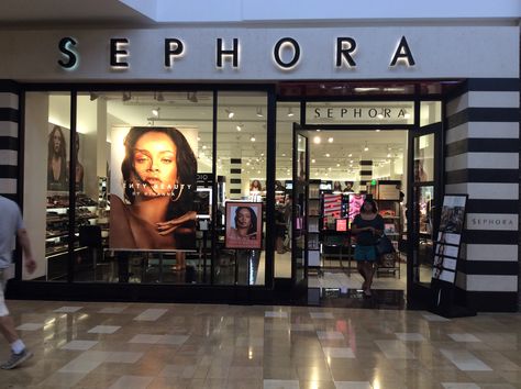 This is the outside Sephora, a beauty make-up store, at the Chandler Mall. The company uses a clean, sleek, and sophisticated style of black and white stripes contrasting with black font. Black can be paired with just about any color and allows for and represents their high-end​ products inside the store. Also, using Rhianna on the front of the store attracts people too. Mall Makeup, Makeup Stores, Sephora Store, Illuminated Signage, Lady Gaga Pictures, Shop Signage, Signage Display, Retail Signs, Sephora Beauty