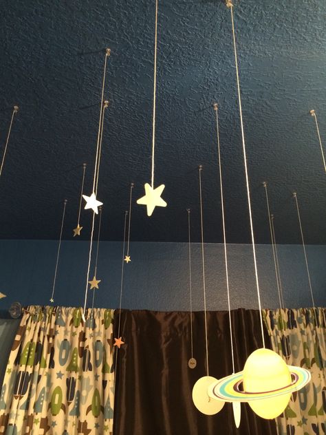 Hang glow in the dark stars from the ceiling to give them a more three dimensional look that's out of this world! I used a hot glue gun, string and thumb tacks. Bedroom Ceiling Hanging Decor, Glow In The Dark Stars On Ceiling Aesthetic, Glow In The Dark Stars On Ceiling Ideas, Light Up Stars On Ceiling, Cool Things To Hang From The Ceiling, Stuff To Hang On Your Ceiling, Glowing Stars On Ceiling, How To Hang Things From The Ceiling, Funky Ceiling Lights