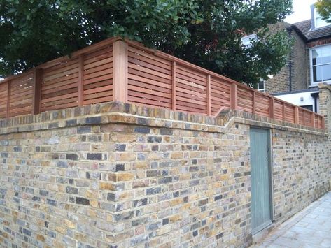 Fencing On Top Of Brick Wall, Landscaping Hill, House Fencing, Annexe Ideas, Bricks House, Modern Fencing, Garden Redesign, Brick House Exterior Makeover, Slatted Fence