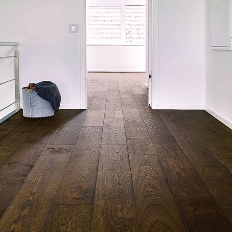 With the current trend of bright board floors these dark oak boards really stand out to us. There's just something special about the contrast between the white walls and the dark floor. #bedifferent #standout | interior design ideas | Raumgestaltung | Flooring ideas | Dielenboden | #flooring #madeingermany Dark Floor Boards, Wooden Floor Ideas, Floor Stain Colors, Dark Oak Flooring, Wood Floor Stain Colors, Dark Wooden Floor, Light Hardwood, Hardwood Floors Dark, Light Hardwood Floors