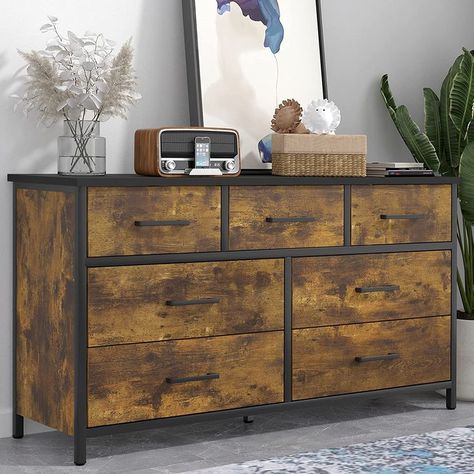 Upgrade your bedroom organization with a 7-drawer dresser. This metal-framed dresser features a durable MDF wooden top and 7 MDF drawers with easy-to-pull metal handles and safety stops. With ample storage space, store all your clothes and accessories in one convenient place. This versatile vertical chest of drawers can be used in various spaces, making it an ideal storage solution for small spaces. Add this stylish industrial-style storage chest to your furniture sets. Click Now! Frame Storage, Storage Dresser, Dresser For Bedroom, 7 Drawer Dresser, Industrial Wood, Chests Of Drawers, Industrial Storage, Wood Dresser, Bedroom Furniture Dresser