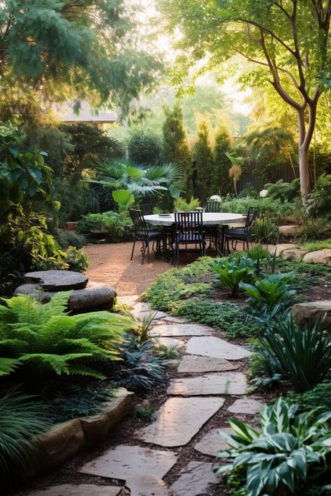 Creating a focal point in your garden design is key, the pathway through foliage leading to an open area with seating and a table for gathering is a wonderful way to create lines and draw focus in a garden design. Focal Point Garden, Garden Focal Point, Tropical Backyard, Outside Seating, Tropical Gardens, Backyard Diy, Garden Dining, Landscape Garden, Backyard Diy Projects