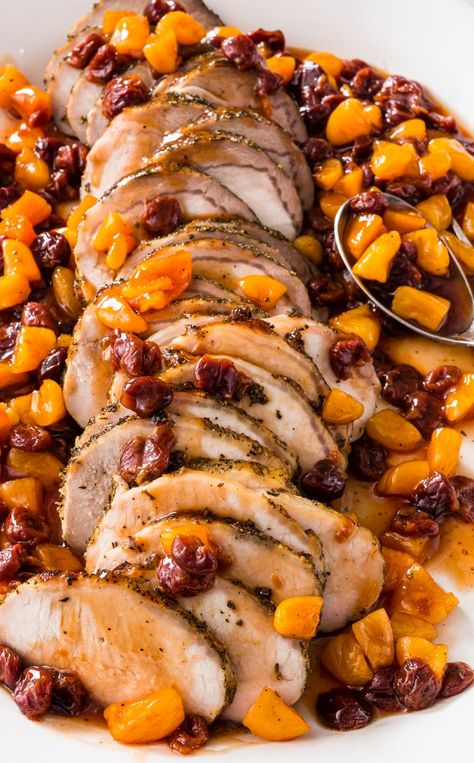 Roast Pork Loin with Dried Fruit: This recipe requires only a handful of ingredients but makes for an eye-catching holiday roast. Pork Loin Recipes With Apricot Preserves, Pork Roast Apples Oven, Fruit Stuffed Pork Loin, Roasted Pork Loin With Apples, Crown Roast Recipe, Ginger Citrus Pork Roast, Fruit Stuffing, Roast Pork Loin, Holiday Roast