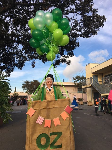 Wizard of Oz Hot Air Balloon costume. (Be forewarned...the balloons are the most expensive part of the costume!) The Wizard Costume Wizard Of Oz, Wizard Of Oz Costume Wizard, The Wizard Of Oz Party, Wizard Of Oz Themed Party Decor, Wizard Of Oz School Decorations, Wizard Of Oz Bridal Shower Ideas, Wizard Of Oz Photo Booth, Wizard If Oz Trunk Or Treat, Wizard Of Oz Float Ideas Homecoming