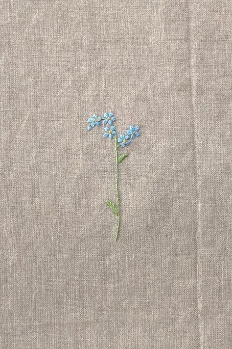 "Handmade Embroidery \"Forget-Me-Not\" Choose this embroidery for any item of our shop: 1. Add any item you would like to get with this embroidery to your basket, 2. Add the name of the item to which you want to add it in the personalisation box, 3. Add this embroidery to your basket. Each piece of handmade embroidery is unique, even when using the same pattern, so you will never find two completely identical pieces, but yet all of them are equally cute and beautiful." Forget Me Not Flowers Embroidery Pattern, Simple Floral Embroidery Designs, Embroidered Forget Me Nots, Embrodery Stiching Flower, Simple Flower Embroidery Pattern, Small Flower Embroidery Designs, Tiny Embroidery Patterns, Simple Embroidery Designs For Beginners, Small Embroidery Flowers