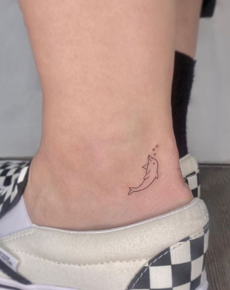 Small 4 Tattoo, Ankle Dolphin Tattoo, Earth Related Tattoos, Fine Line Tattoo Dolphin, Tiny Dolphin Tattoo Simple, Mini Dolphin Tattoo, Dainty Dolphin Tattoo, Two Dolphins Tattoo, Dolphin Tattoo Simple