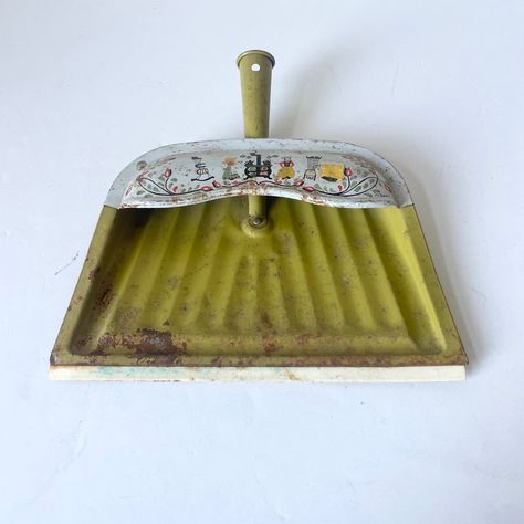 This vintage green colored metal dust pan is a beautiful and unique addition to any Mid Century Modern kitchen. Its retro design brings a touch of rustic charm and nostalgia to your space, making it a perfect cleaning tool for a farmhouse-style home.  This dust pan is the perfect combination of form and function, making it a must-have for any lover of vintage design. Condition: This is in vintage pre-owned condition with some wear and rust spots. All very normal for its age. I like the patina and think it adds to the nostalgia factor.  **To see more vintage kitchen and home decor in my shop, please visit here:  https://www.etsy.com/shop/HowFastTimeFlies?ref=profile_header&section_id=32309804 SHIPPING: I package your items with great care. The shipping might cost a little more as I add more Vintage Household Items, Kitchen Wear, Floral Farmhouse, Vintage Kitchen Utensils, Farm Stuff, Olden Days, Mid Century Modern Kitchen, Vintage Enamelware, Dust Pan