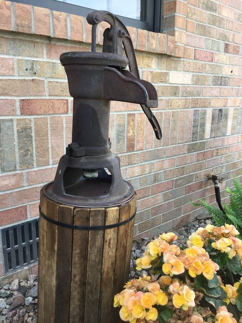 After- Stand for my old hand pump Vintage Well Pump Ideas, Old Well Pump Ideas Water Features, Creative Ways To Cover Well Pump, Pitcher Pump Ideas, Well Pump Cover Ideas Diy, Pipe Covering Ideas, Well Pipe Cover Ideas, Well Head Cover Ideas, Well Pump Cover Ideas