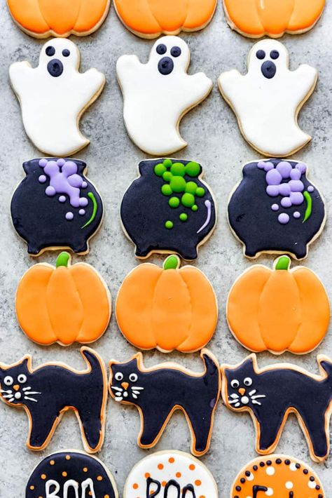 These cut-out Halloween Sugar Cookies are soft and delicious but still hold their shape after baking. Decorate them with my super popular easy royal icing using the easiest techniques ever to scare up some Halloween fun! #sugarcookies #cookies #Halloween #royalicing #decorating #easy #best #soft #homemade Halloween Cookies Decorated Recipe, Halloween Roll Out Cookies, Cookies Halloween Easy, Halloween Flood Icing Cookies, Halloween Cookies Cut Out, Wilton Halloween Cookies, Halloween Biscuits Decorated Cookies, Halloween Cutout Cookies Decorated, Cookie Decorating Icing Ideas