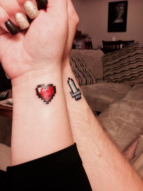 Couple tattoo: Zelda Heart and Sword Bit Tattoo, Couple Wrist Tattoos, Infinity Couple Tattoos, Couple Tattoos Love, Zelda Tattoo, Gamer Tattoos, Tattoo Couple, Cute Couple Tattoos, Small Couple Tattoos