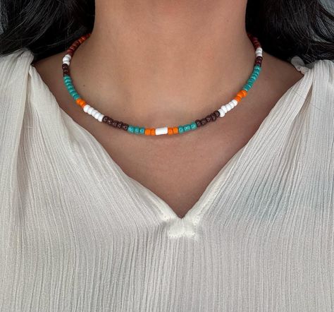 ✨ Back In The Saddle ✨ Definitely a country-feeling classic, this 16” Nylon coated wire choker is filled with turquoise, white, orange, and brown beads, and has a silver lobster closing clasp. She fits right in with those rugged boots and a cowboy hat! 🧡🤠 * Please note that each necklace is custom and handmade, so each may vary slightly. ❗️REMINDER ❗️ Our website will be officially launched on June 21st next week! 🥳 Wire Choker, Rugged Boots, Cowboy Hat, Next Week, Cowboy Hats, Saddle, Choker, Cowboy, Product Launch